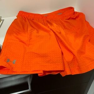 Men’s Under Armour running shorts with zippered compartment on back.